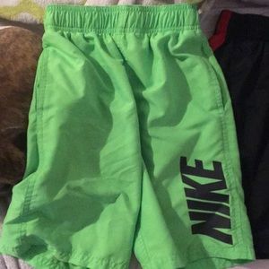 Green Nike swim trunks